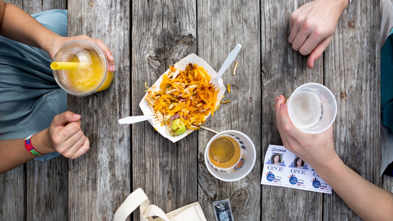 Friends enjoying food and drinks at Crave Festival